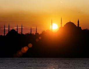 Poster Hagia Sophia and The Blue Mosque during sunset in Istanbul Turkey © nexusseven