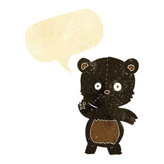 cartoon waving black bear with speech bubble