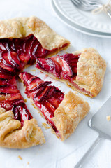 Sweet fruit tart plum galette pie cut into slices