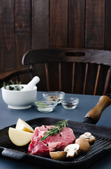 Cooking preparation in the kitchen with raw beef steak