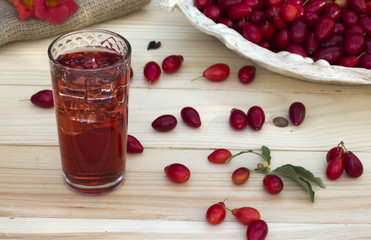 Red cornel in a dish and juice with ice
