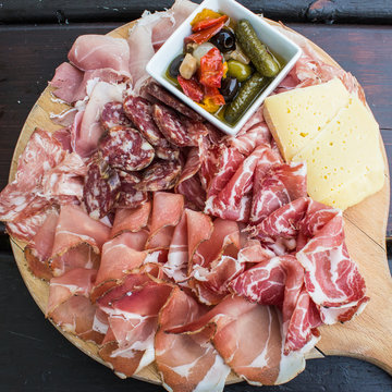 typical Italian appetizer with salami, cheese and pickles