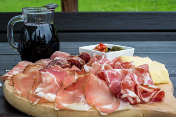 typical Italian appetizer with salami, cheese and pickles