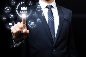 Businessman clicking on email icon
