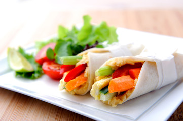 Healthy bite size wraps with carrot, capsicum and a side salad