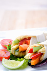 Healthy bite size wraps with side salad and lots of copyspace