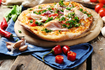 Tasty pizza with vegetables on table close up
