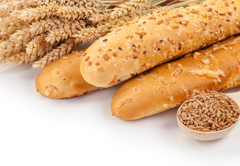 Bread, ears and grains of wheat on a white background isolation