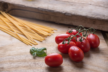 Ingredients for a typical italian lunch lying on a wooden table