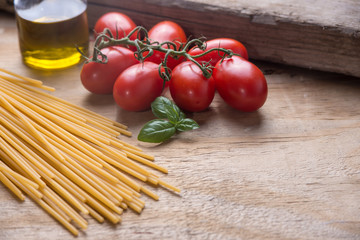 Ingredients for a typical italian lunch lying on a wooden table