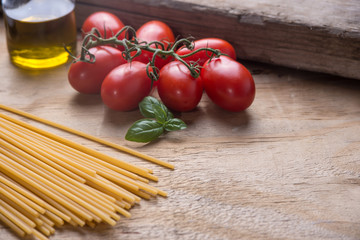 Ingredients for a typical italian lunch lying on a wooden table