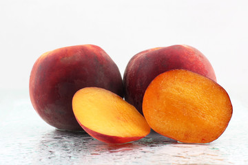 two ripe peach on a white background