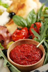 Ingredients of Mediterranean cuisine, on wooden tray, on wooden background