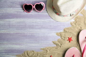 Summer items on wooden background