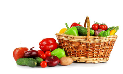 Heap of fresh fruits and vegetables  in basket isolated on white