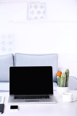 Modern workplace with laptop, close up