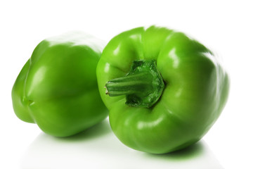 Group of green peppers isolated on white