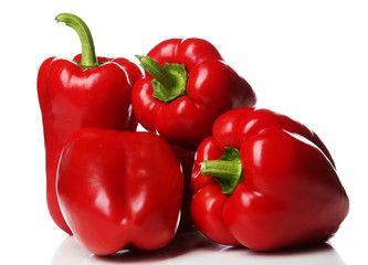 Group of red peppers isolated on white