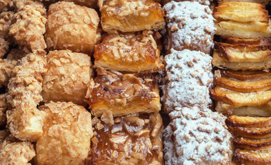 Sweet pastry, puff pastry with powdered sugar, with pine nuts,  with jam made from Siam pumpkin, puff pastry with roasted apples and  with baked apples.