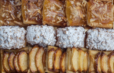 Sweet pastry, puff pastry with powdered sugar, with pine nuts,  with jam made from Siam pumpkin, puff pastry with roasted apples and  with baked apples.