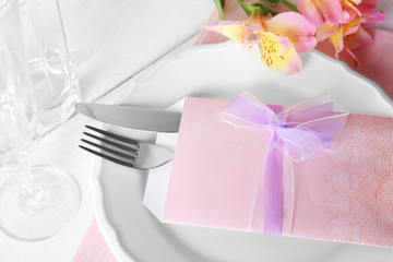 Table setting with spring flowers, close-up