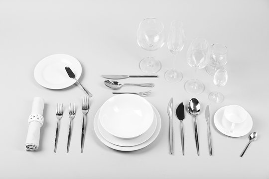 Table setting, close up, on grey background