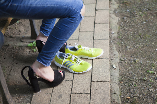 Women are in place to wear sports shoes