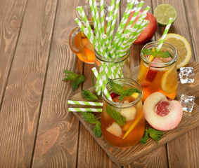 Ice tea with lemon, peach and mint