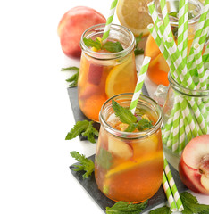 Ice tea with lemon, peach and mint