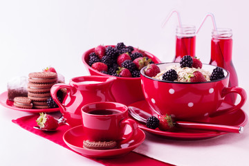 Breakfast - granola with blueberries and strawberries, coffee wi