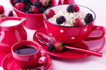 Breakfast - granola with blueberries and strawberries, coffee wi