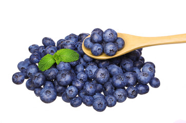 Blueberry in wooden spoon isolated on white