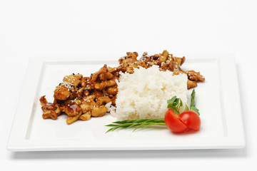 Rice with meat and herbs on white plate