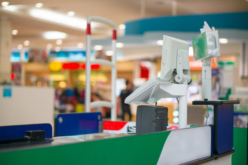 Empty cash desk with computer terminal in supermarket