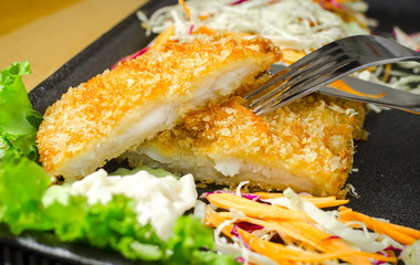 close-up shot of breaded fried fish steak