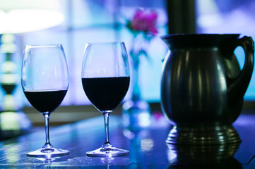 Two glasses of red wine.