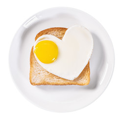 heart-shaped fried eggs and fried toast isolated