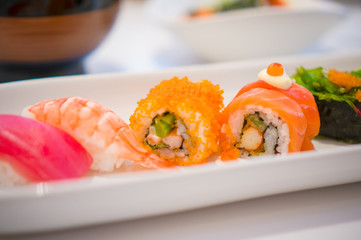 Sushi set with rolls in Japanese restaurant