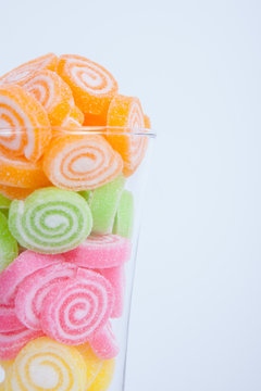 Jelly sweet, flavor fruit, candy dessert colorful in glass on wh