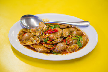 Stir friend oysters with salad of vegetables and spices in asian