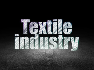 Fototapeta na wymiar Industry concept: Textile Industry in grunge dark room