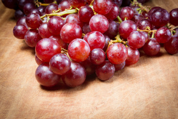 Red Grapes on a wooden table