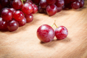 Red Grapes on a wooden table