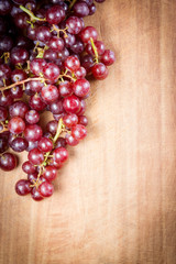 Red Grapes on a wooden table