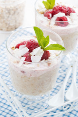 dessert with oatmeal, whipped cream and raspberries, close-up