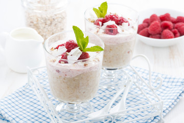 dessert with oatmeal, whipped cream and raspberries, horizontal