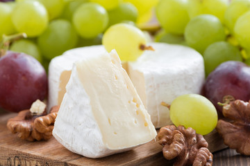 fresh camembert, walnuts and fresh grapes, close-up