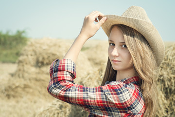 Portrait of a young beautiful girl in style of the country