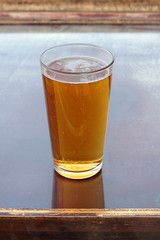 Glass full of cold and refreshing lager beer.
