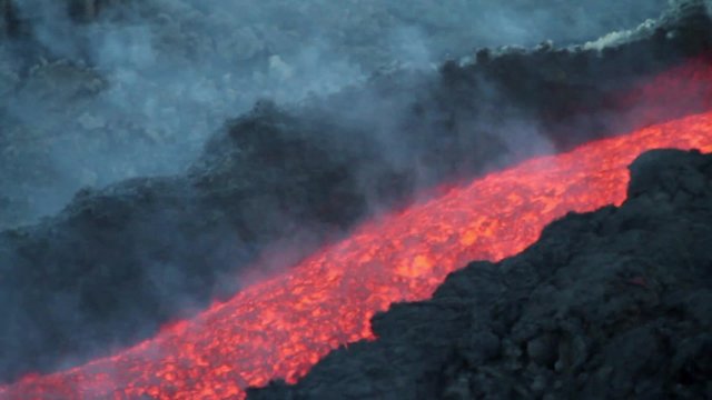 Volcanic lava flowing. Mount Etna eruption
